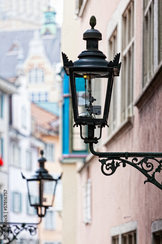 Decorative lamp on a house wall, Zurich, Switzerland Decorative lamp on a house wall, Zurich, Switzerland