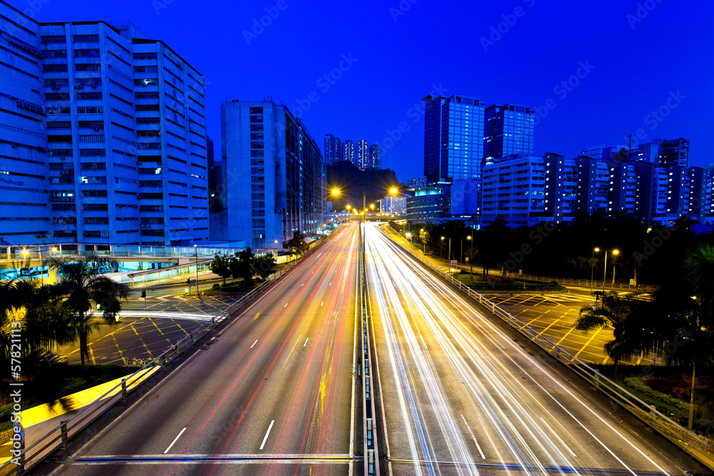 Moving cars on highway at night