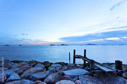 Sea stones sunset with bridge background