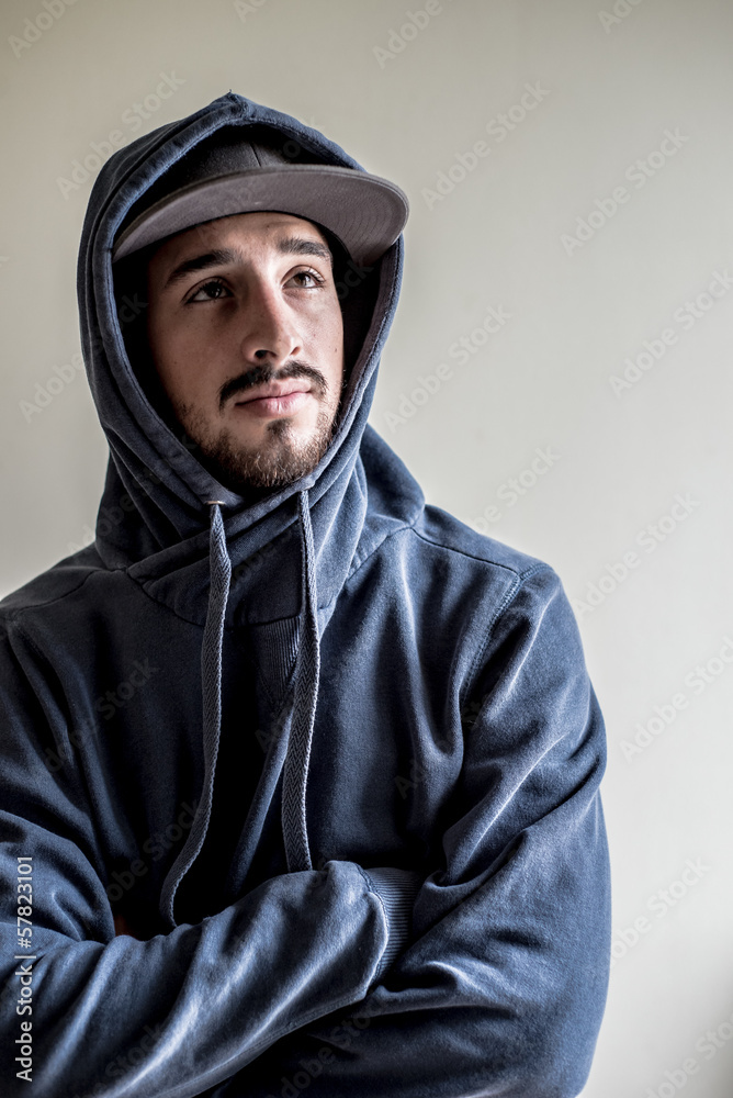young stylish man with sport hat young stylish man with sport hat