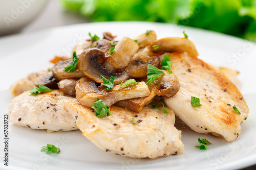 Fried chicken fillet with mushrooms