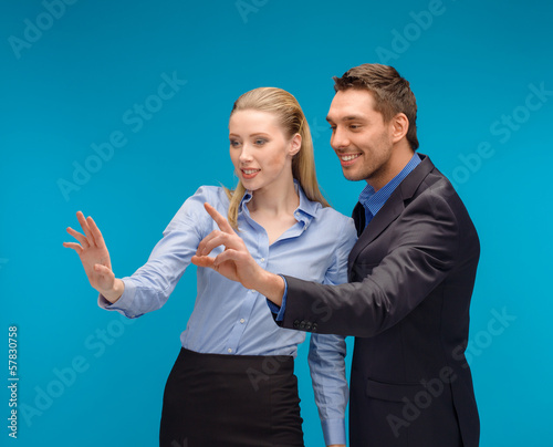 woman and man working with virtual screen