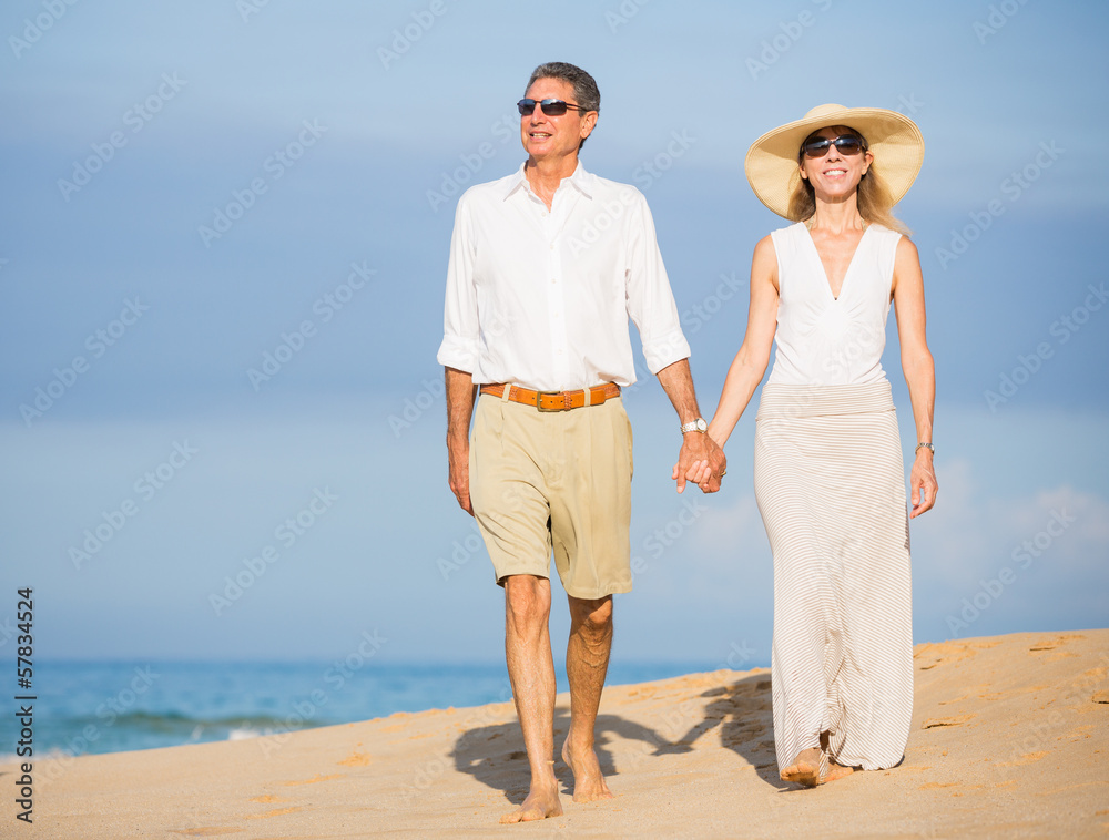 Happy senior couple on the beach. Retirement Luxury Tropical Res Happy senior couple on the beach. Retirement Luxury Tropical Res