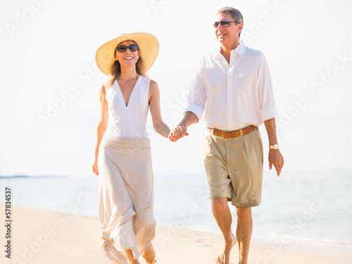 Happy senior couple on the beach. Retirement Luxury Tropical Res © EpicStockMedia