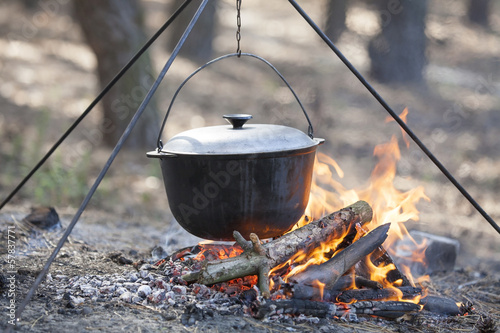 Cooking in the forest.