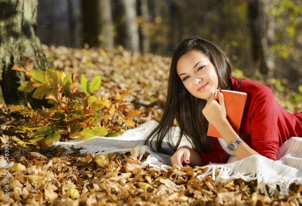 beautiful girl with book in the autumn park beautiful girl with book in the autumn park