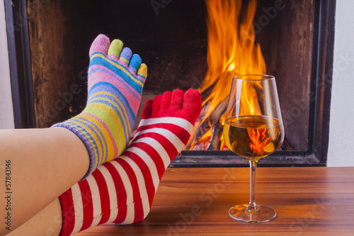  relaxing at fireplace in colorful funny toesocks