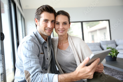 Couple at home websurfing on the net