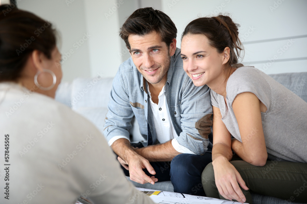 Couple meeting architect for house construction Couple meeting architect for house construction