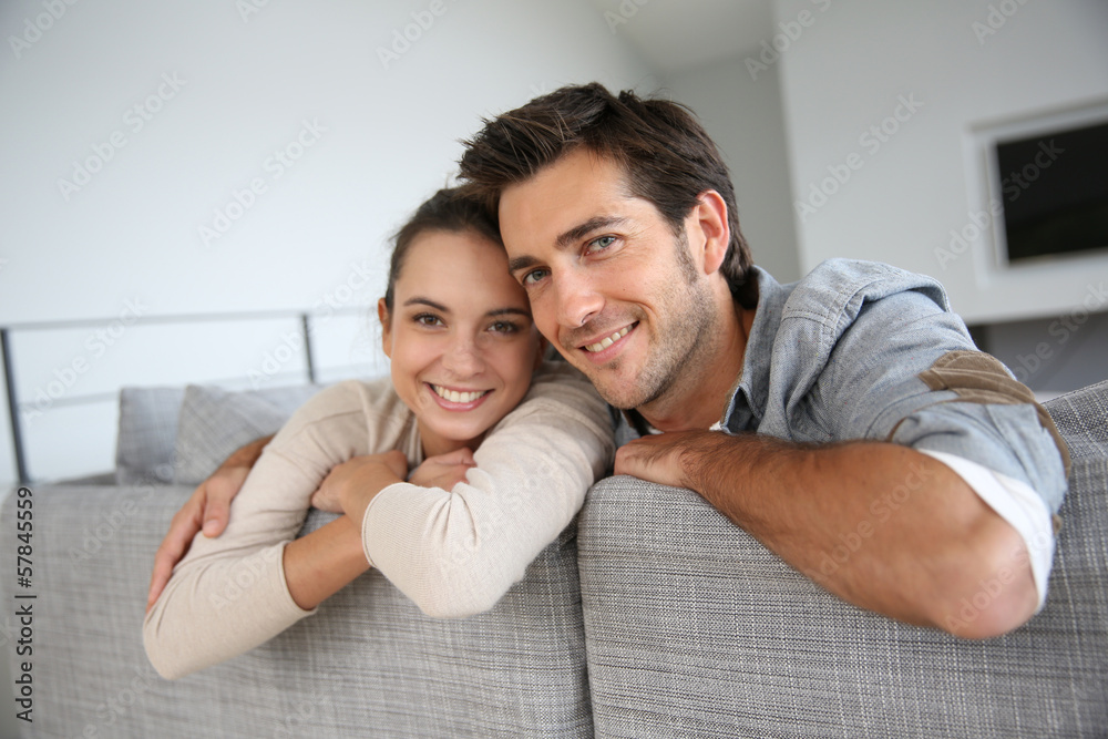 Couple at home relaxing in sofa Couple at home relaxing in sofa