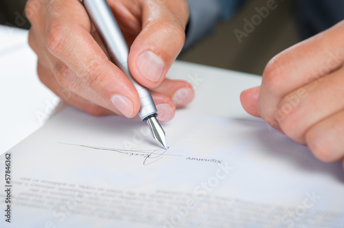 Businessman Signing Document