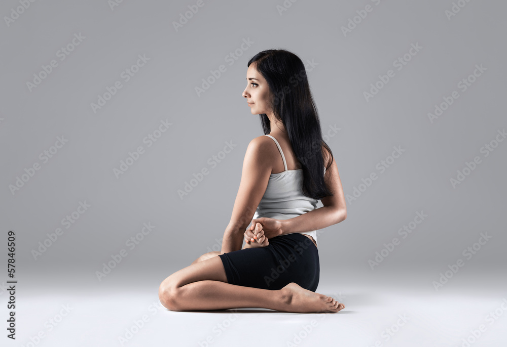 woman in bharadvadzasana yoga position