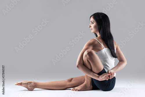 woman in marachiasana yoga position