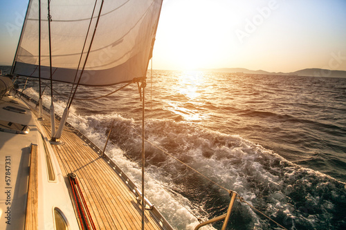 Yacht sailing during sunset. Luxury yachts. © De Visu