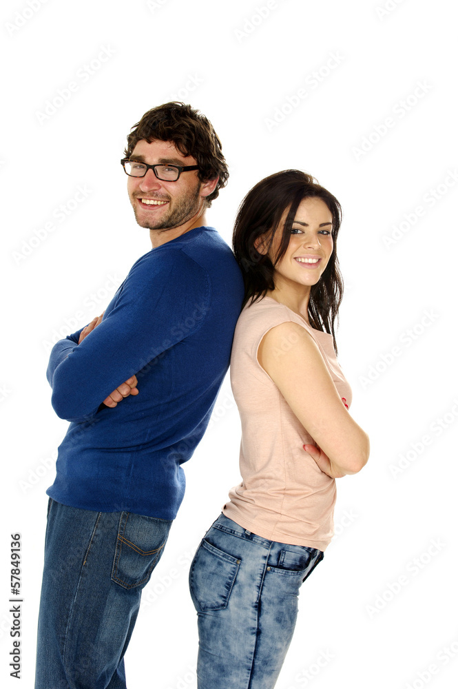Beautiful couple stood back to back isolated on a white backgrou Beautiful couple stood back to back isolated on a white backgrou