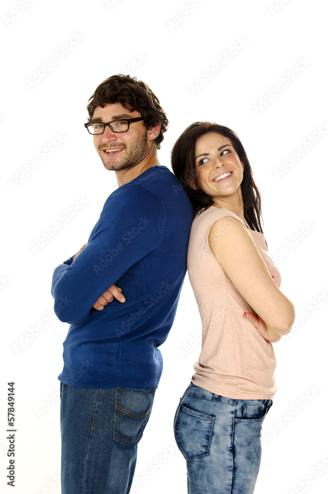 Beautiful couple stood back to back isolated on a white backgrou Beautiful couple stood back to back isolated on a white backgrou