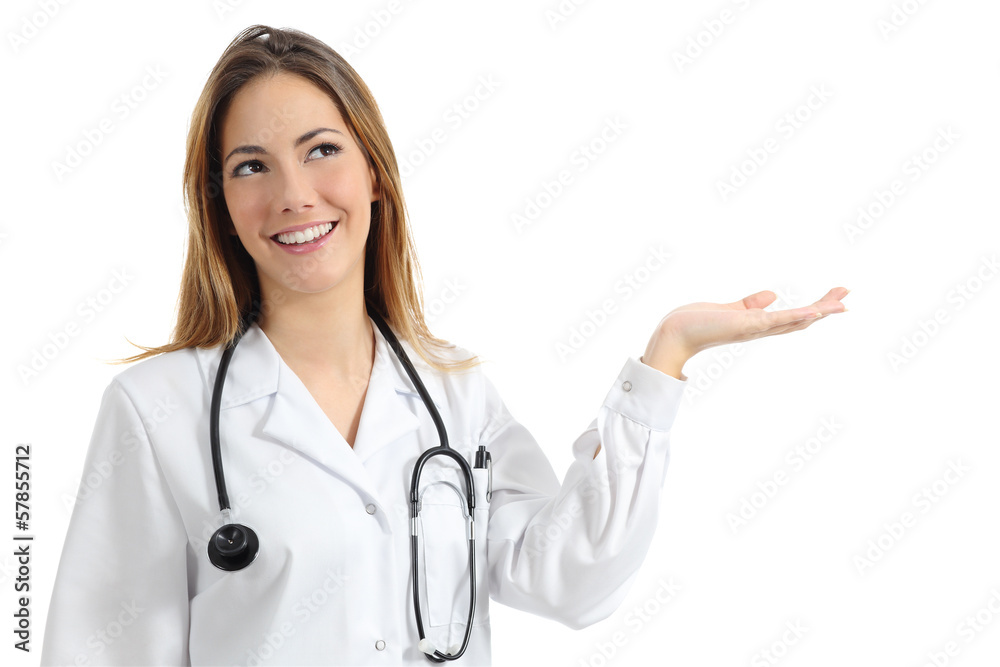 Beautiful female doctor presenting and showing copy space Beautiful female doctor presenting and showing copy space