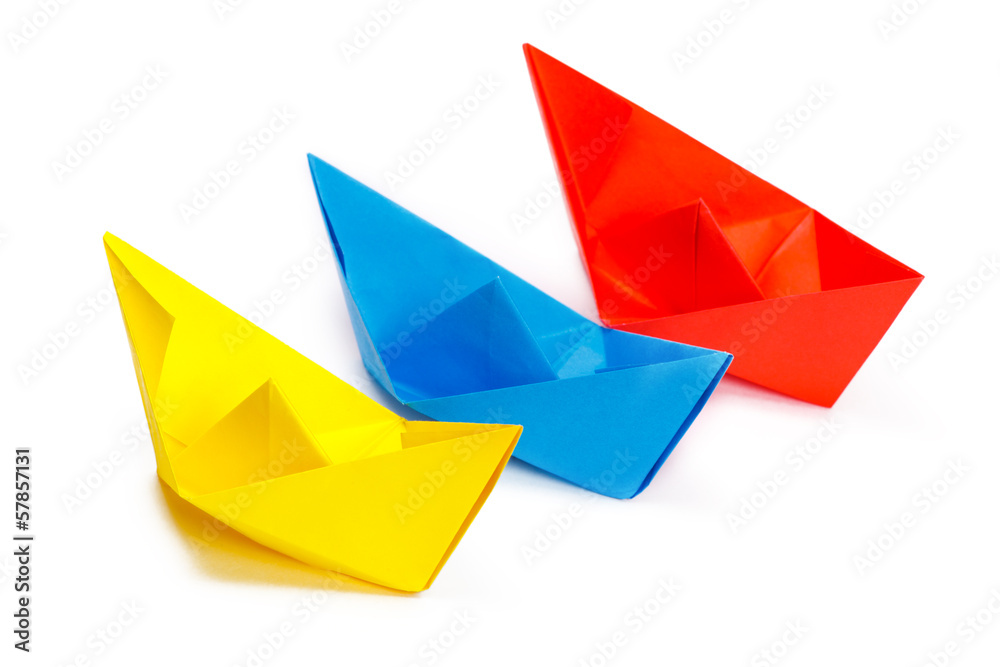 Three colored paper ship on a white background Three colored paper ship on a white background