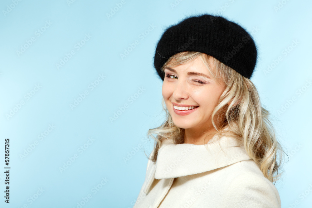 mid adult happy attractive woman gives a wink, winter portrait o mid adult happy attractive woman gives a wink, winter portrait o