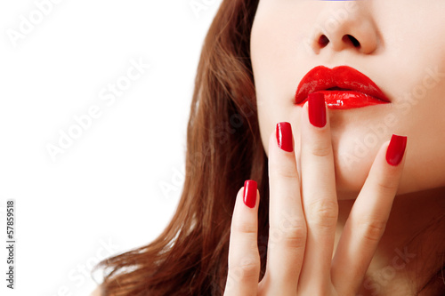 young woman portrait with long hair, red lipstick and manicure,