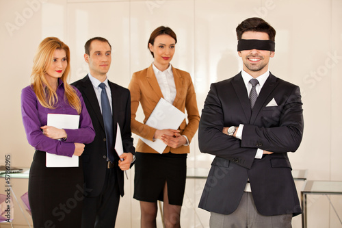 young businessman eyes covered