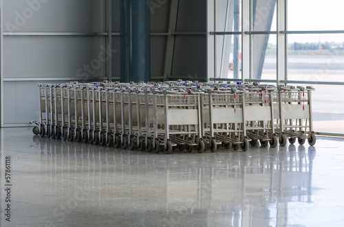 Luggage trolleys in airport terminal