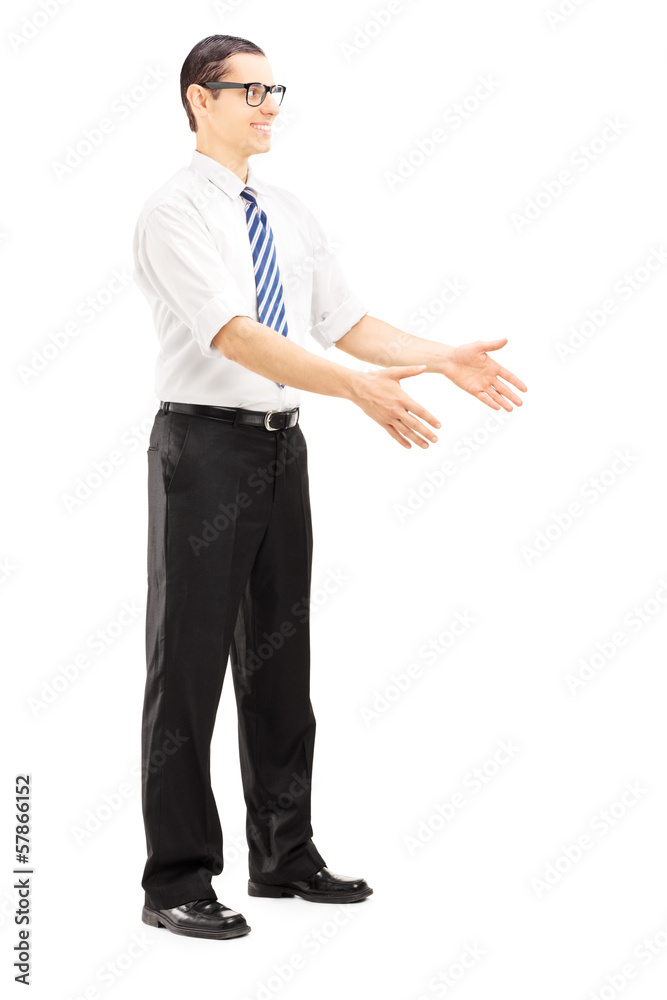 Full length portrait of a smiling young man about to take Full length portrait of a smiling young man about to take