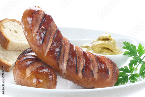 Delicious fried sausage on plate