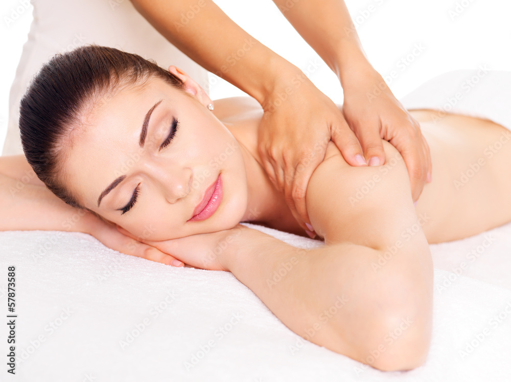 Woman having massage of body in spa salon