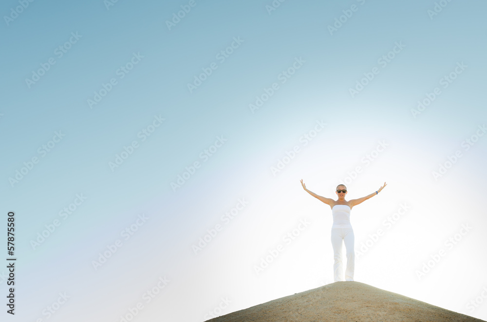 Young woman on top of the mountain Young woman on top of the mountain