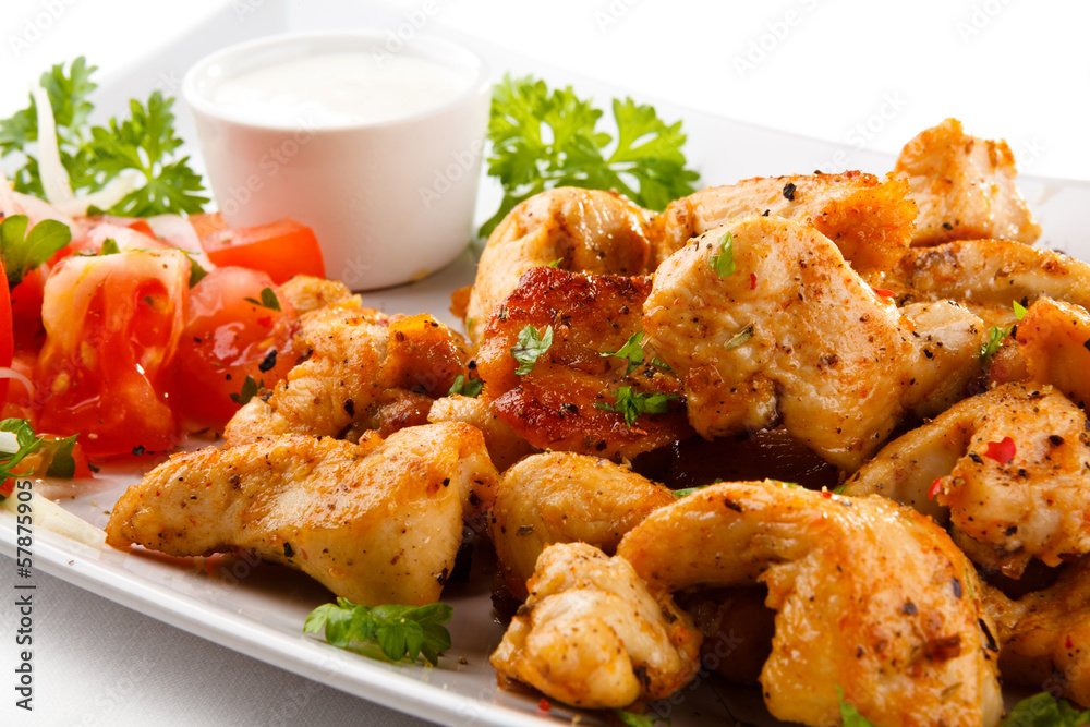 Grilled meat and vegetables on white background Grilled meat and vegetables on white background
