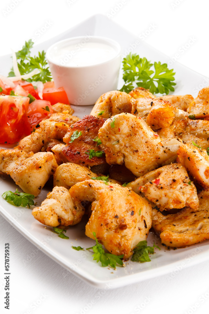 Grilled meat and vegetables on white background Grilled meat and vegetables on white background
