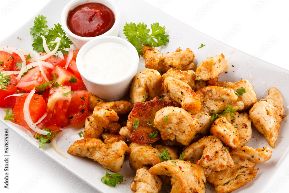 Fototapeta premium Grilled meat and vegetables on white background