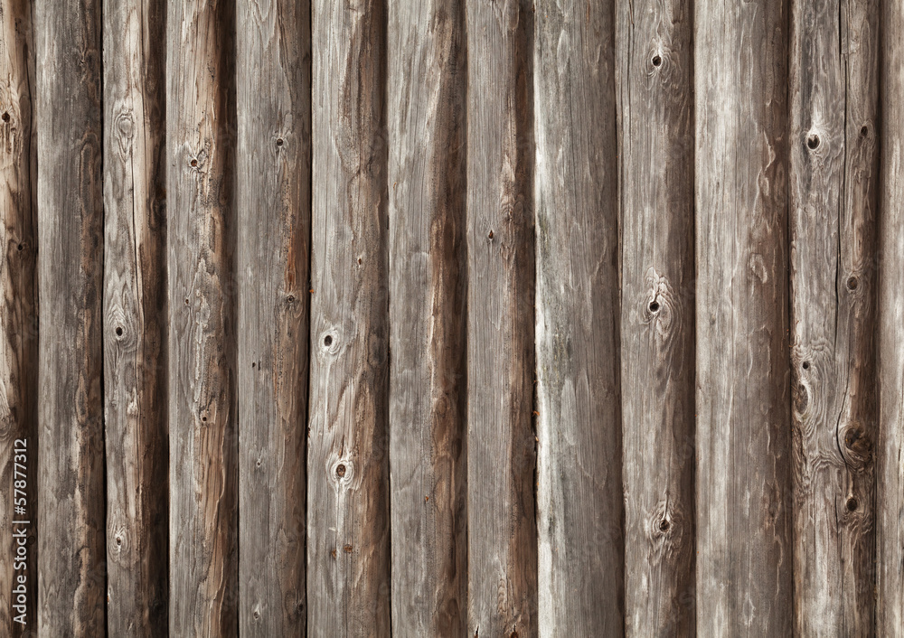 Old brown wooden wall of rural house made of logs Old brown wooden wall of rural house made of logs