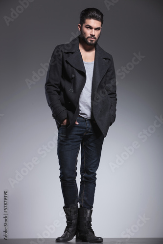 full body picture of a fashion man with beard looking away
