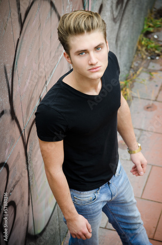 Attractive blond young man in city environment © theartofphoto