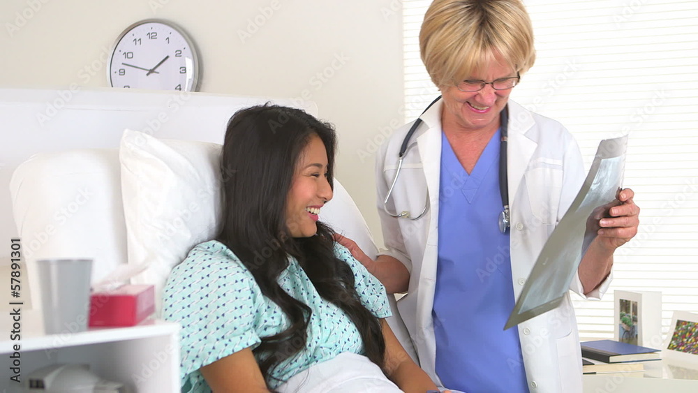 Doctor reviewing Japanese patient's x-ray Doctor reviewing Japanese patient's x-ray