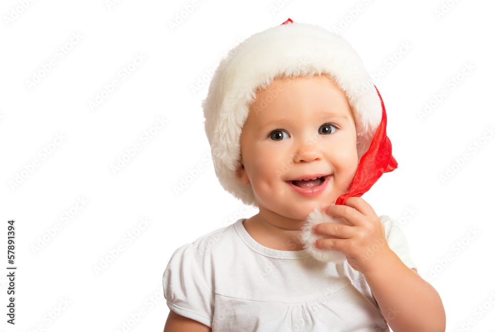 Beautiful happy funny baby in a Christmas hat isolated Beautiful happy funny baby in a Christmas hat isolated