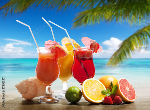 cocktaisl and tropical fruit on the beach #57892397