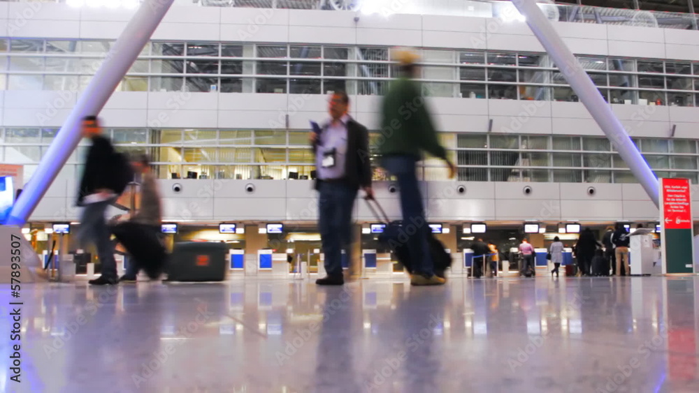 People travelling through airport terminal