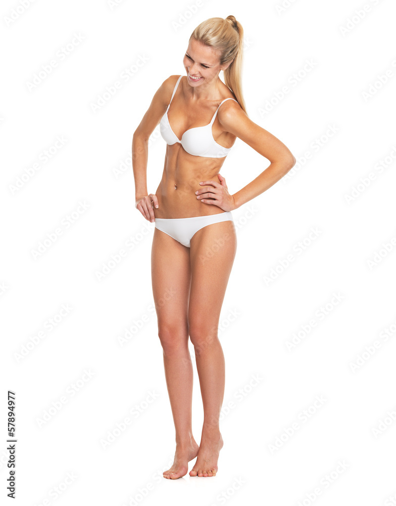 Full length portrait of laughing young woman in lingerie Full length portrait of laughing young woman in lingerie