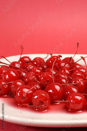 Fotografie Red cocktail maraschino cherries with copy space