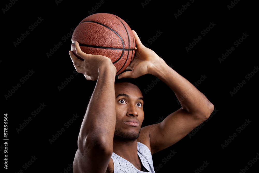 Basketball player against dark background Basketball player against dark background