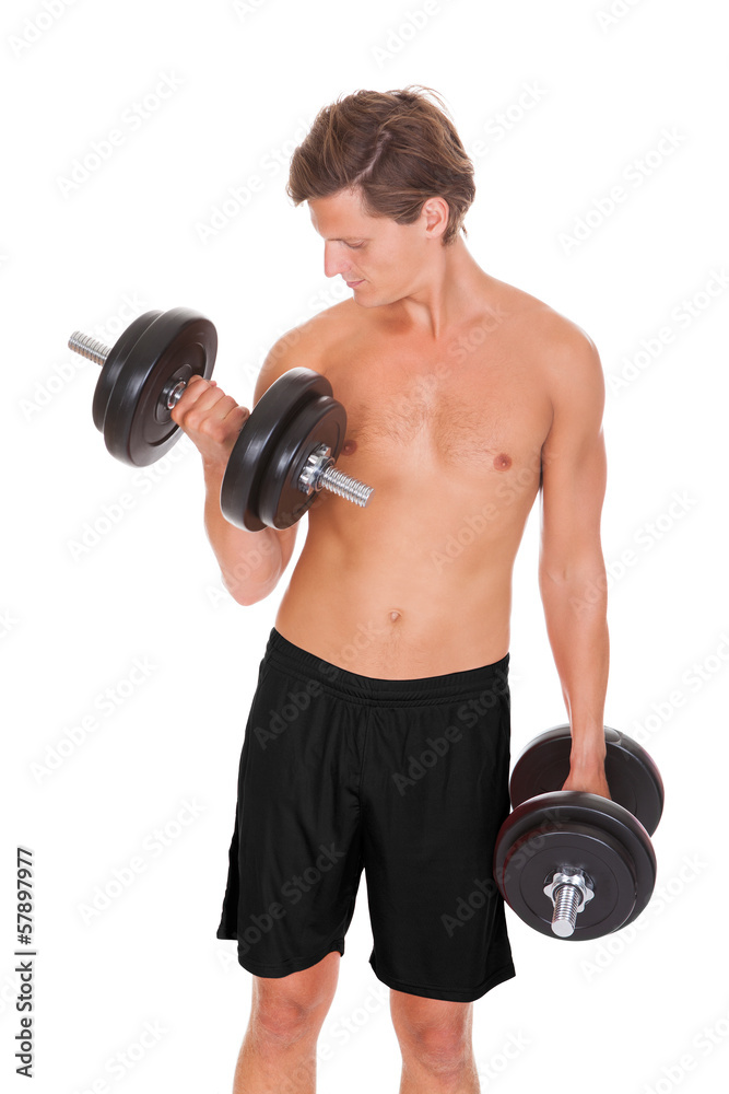 Man Exercising With Dumbbells Man Exercising With Dumbbells