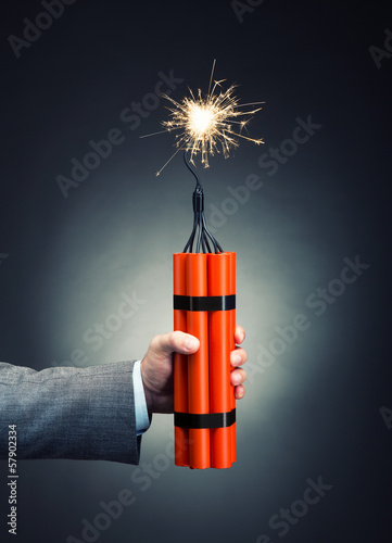 Obraz na plátně Hand holding dynamite