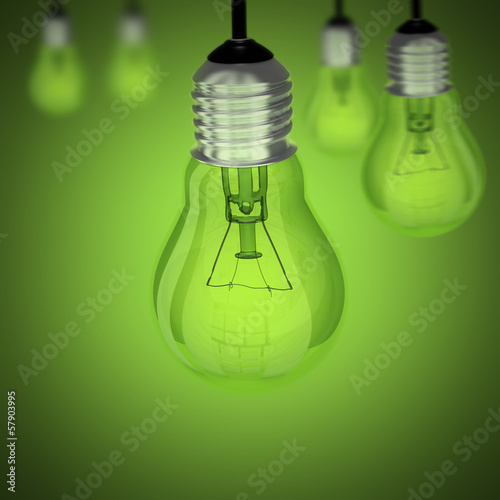 Turned off light bulb on green background