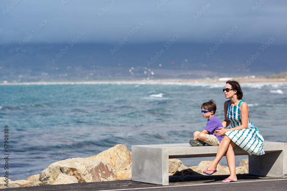 Mother and son enjoying beautiful ocean view