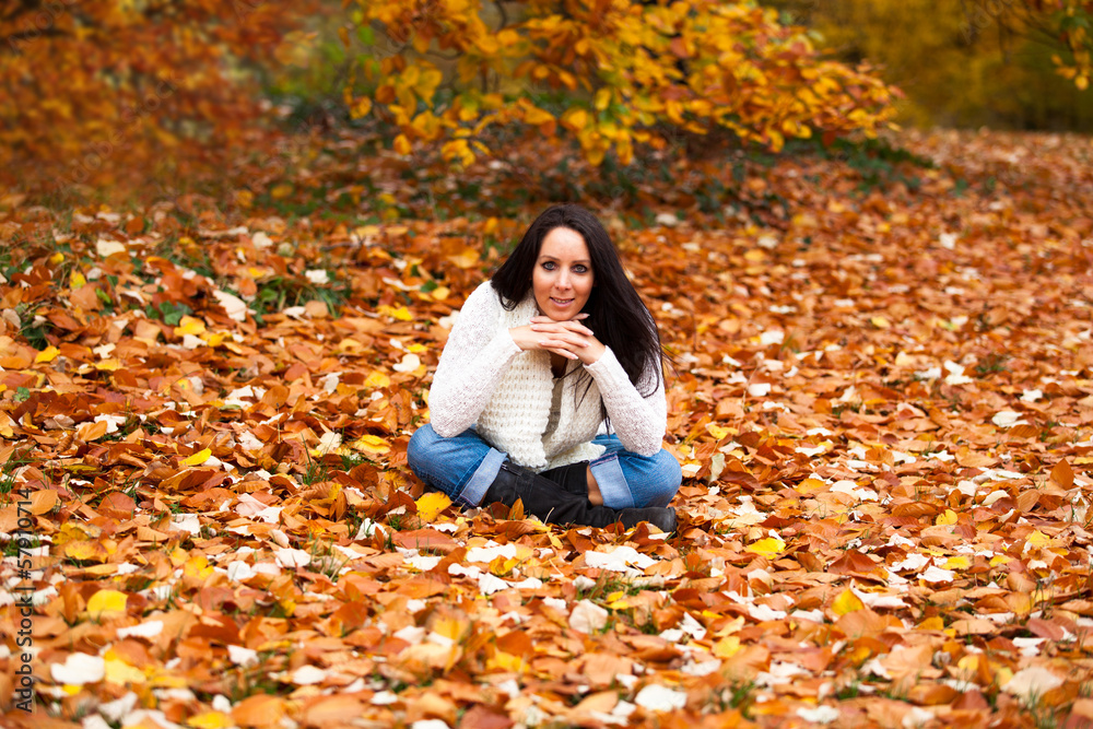 Pretty woman in a park in autumn Pretty woman in a park in autumn
