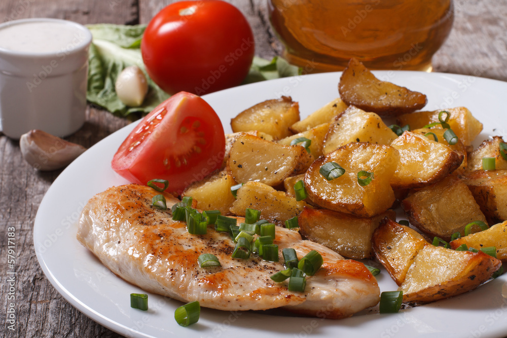 Fried potatoes with chicken steak and vegetables Fried potatoes with chicken steak and vegetables
