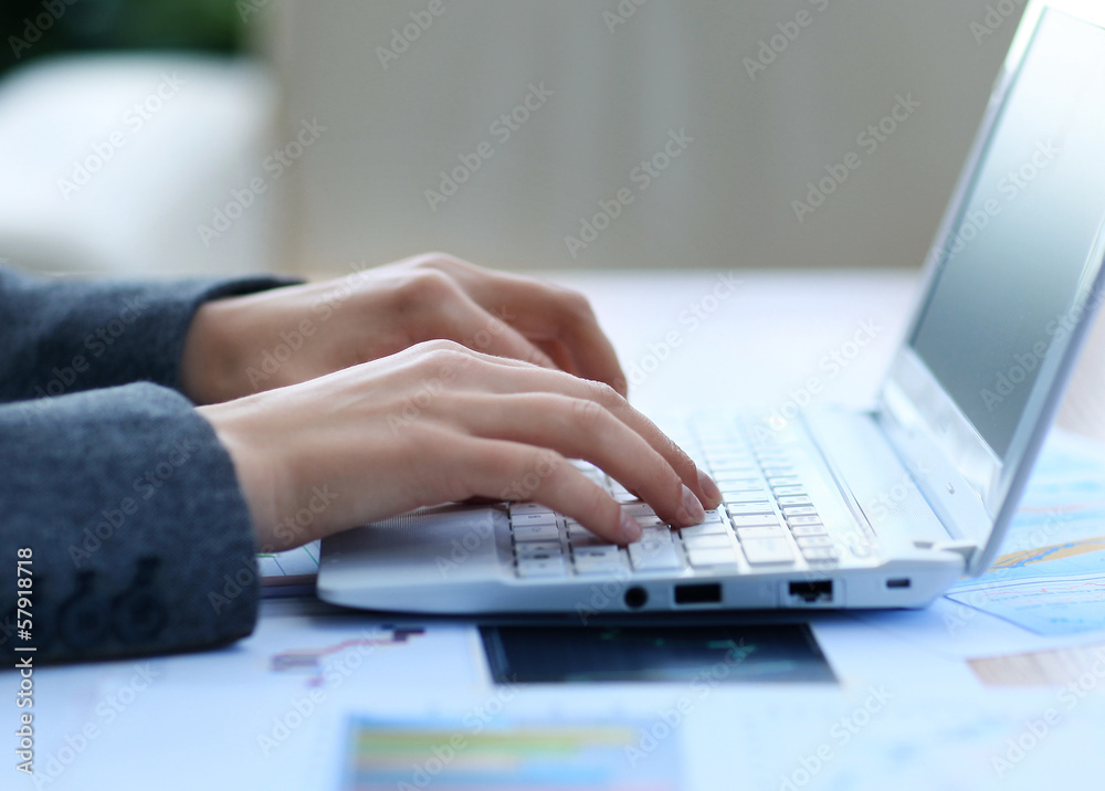 Female hands typing a letter on the keyboard Female hands typing a letter on the keyboard